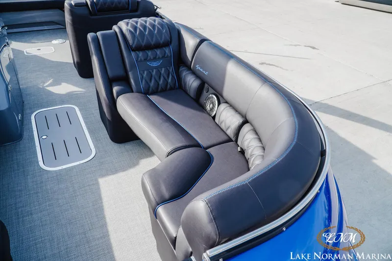 Slide: The Image of 2025 Bennington 25QXSBA pontoon boat with luxurious seating and modern design. - 19