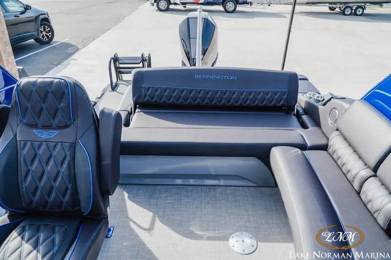 Slide: The Image of 2025 Bennington 25QXSBA boat interior with luxurious seating at Lake Norman Marina. - 21