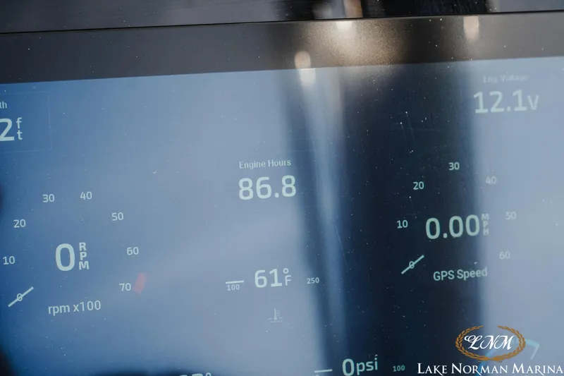 Slide: The Image of Dashboard display of a 2025 Bennington 25QXSBA showing engine hours and GPS speed. - 23