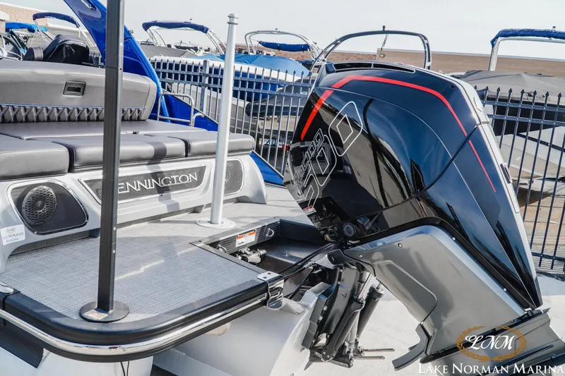Slide: The Image of 2025 Bennington 25QXSBA boat with powerful outboard motor at Lake Norman Marina. - 4