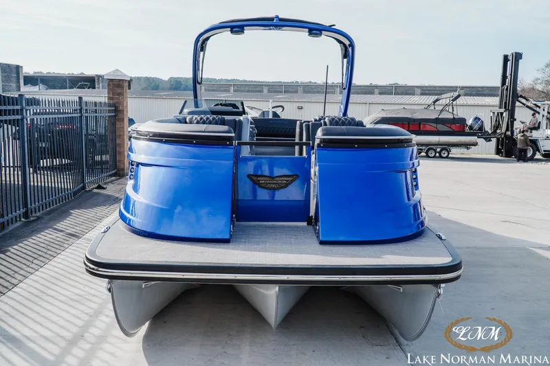 Slide: The Image of 2025 Bennington 25QXSBA pontoon boat in vibrant blue at Lake Norman Marina. - 7