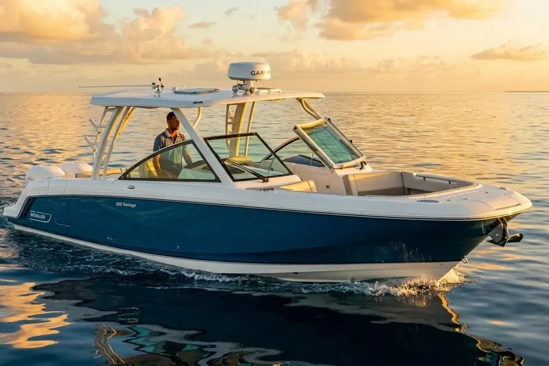 Slide: The Image of 2019 Boston Whaler 320 Vantage cruising on calm ocean at sunset. - 12