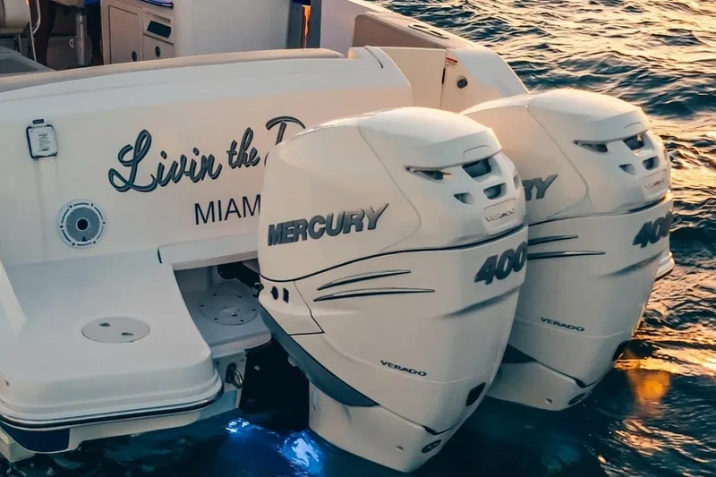 Slide: The Image of 2019 Boston Whaler 320 Vantage with twin Mercury 400 Verado engines on ocean water. - 17