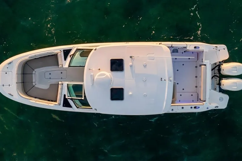 Slide: The Image of Aerial view of 2019 Boston Whaler 320 Vantage boat on clear water. - 20