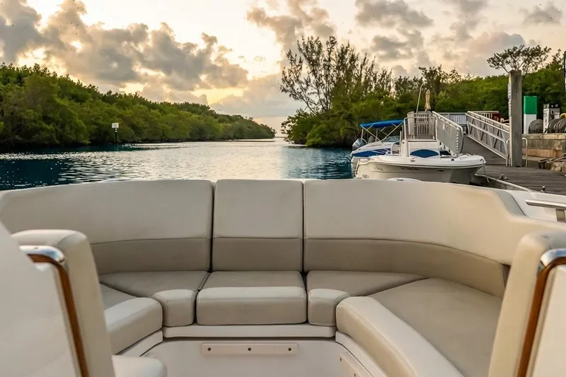 Slide: The Image of 2019 Boston Whaler 320 Vantage boat interior with scenic waterfront view. - 30