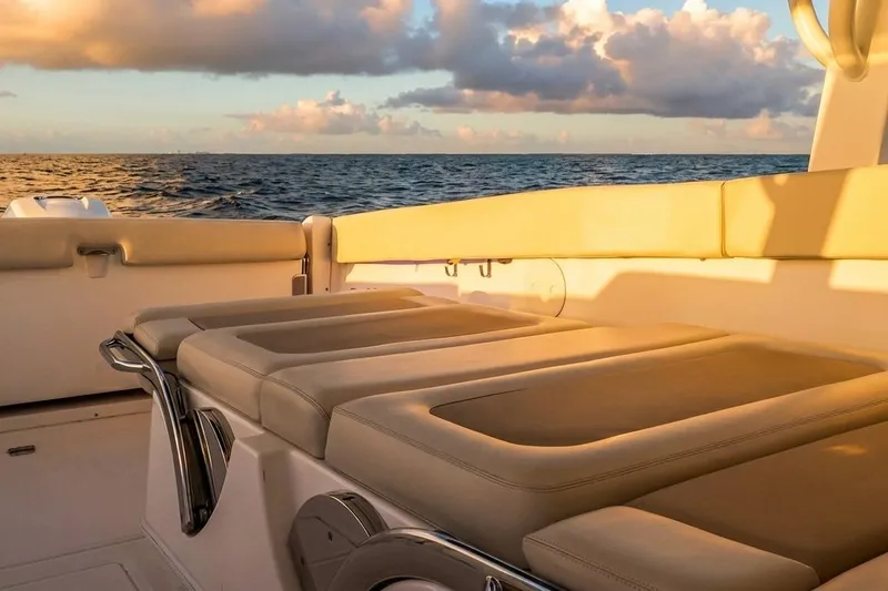 Slide: The Image of 2019 Boston Whaler 320 Vantage boat interior at sunset, with ocean view. - 41