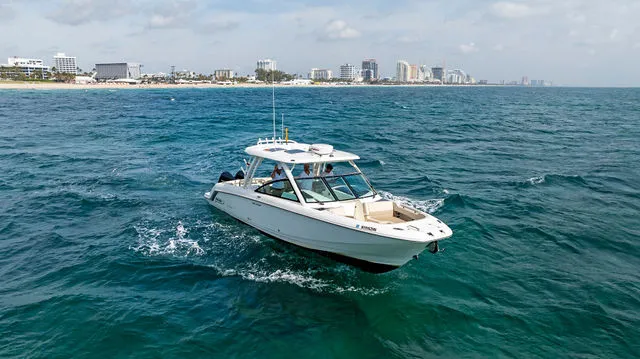 The Image of 2020 Boston Whaler 320 Vantage boat on clear blue ocean water. - 47