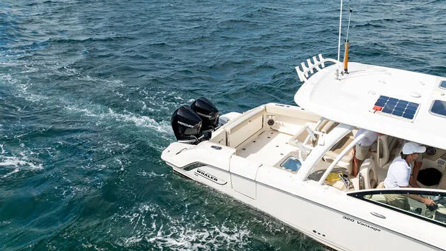 Slide: The Image of 2020 Boston Whaler 320 Vantage helm with dual navigation screens and controls. - 56