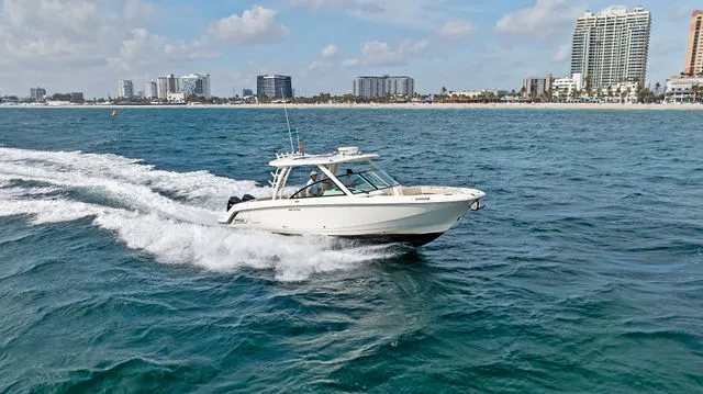Slide: The Image of 2020 Boston Whaler 320 Vantage engine compartment with wiring and batteries. - 60