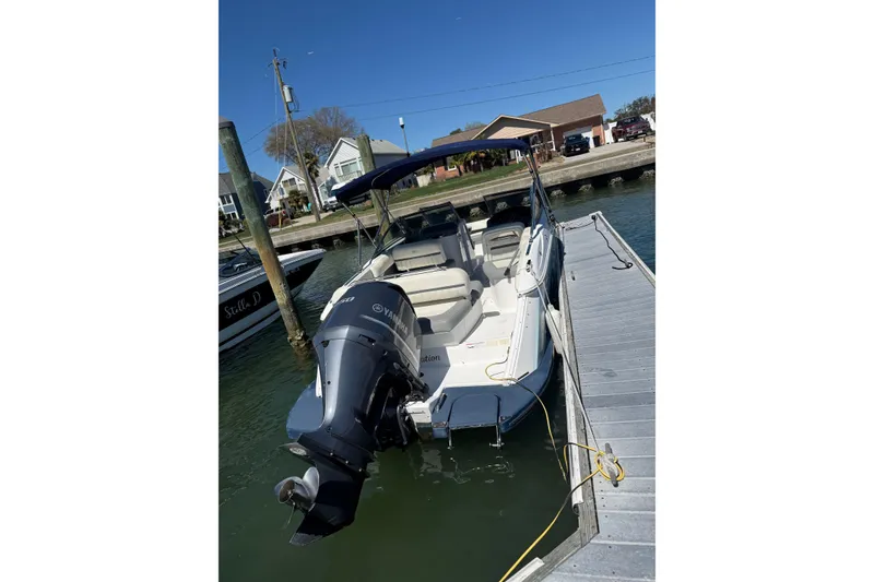 Slide: The Image of 2020 Cobalt CS23 boat docked with Yamaha outboard motor, sunny day. - 11