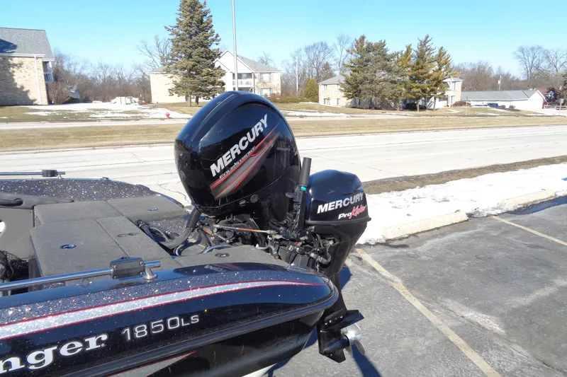 Slide: The Image of 2014 Ranger 1850 LS boat with Mercury outboard motor in a snowy parking lot. - 10