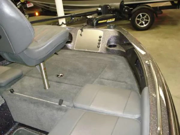 Slide: The Image of Interior of a 2014 Ranger 1850 LS boat with gray seating. - 13