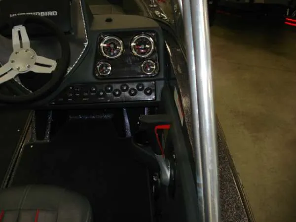 Slide: The Image of Dashboard of a 2014 Ranger 1850 LS boat with steering and gauges. - 14
