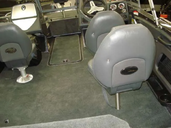Slide: The Image of Interior of a 2014 Ranger 1850 LS boat with gray seats. - 20
