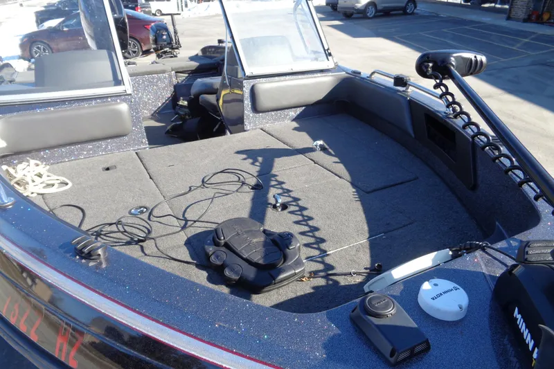 Slide: The Image of 2014 Ranger 1850 LS boat interior with fishing equipment and controls. - 29