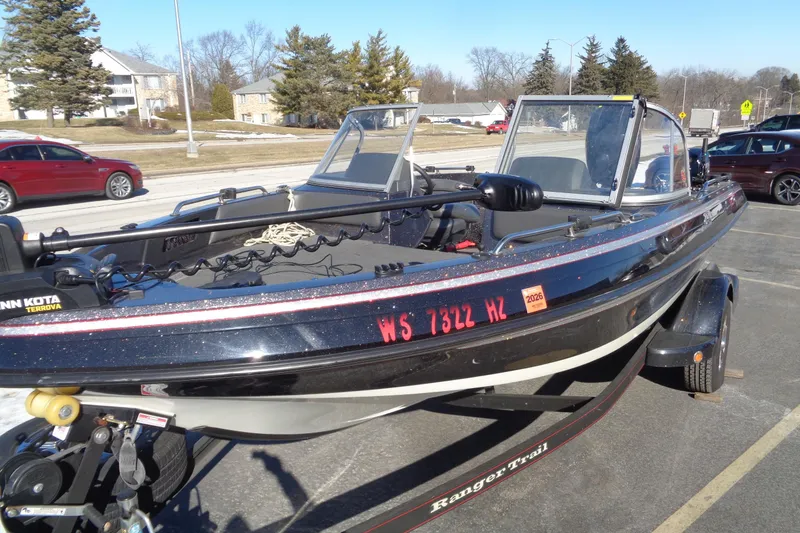 Slide: The Image of 2014 Ranger 1850 LS boat on trailer in parking lot, featuring Minn Kota Terrova motor. - 3