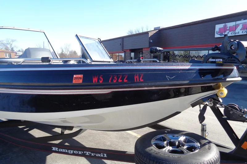 Slide: The Image of 2014 Ranger 1850 LS boat on trailer, Minn Kota motor, registration visible. - 30