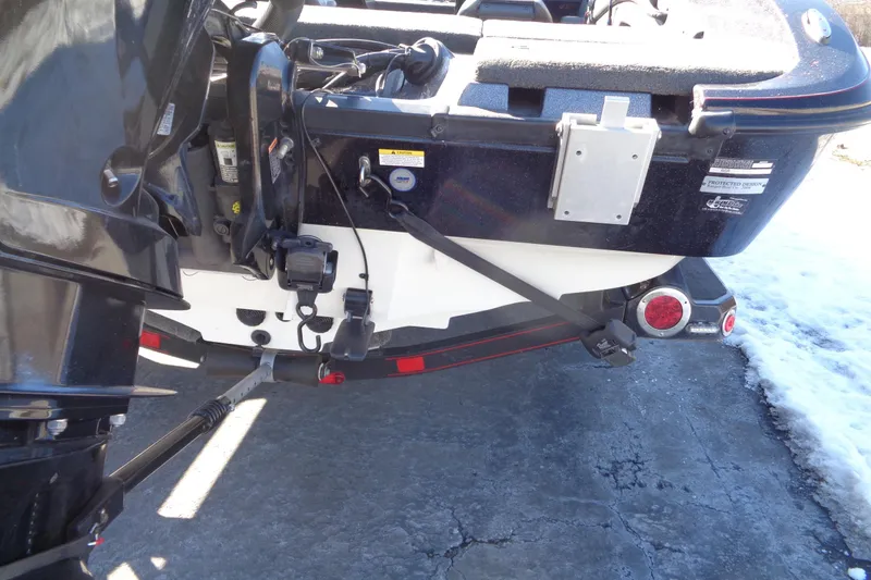Slide: The Image of Rear view of a 2014 Ranger 1850 LS boat on a trailer, showing motor and equipment. - 36