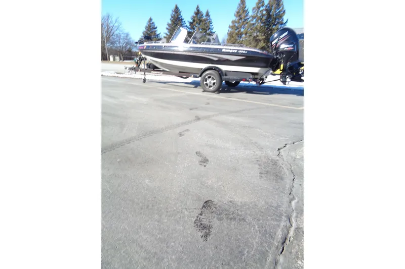 Slide: The Image of 2014 Ranger 1850 LS boat on trailer in parking lot, winter setting. - 39