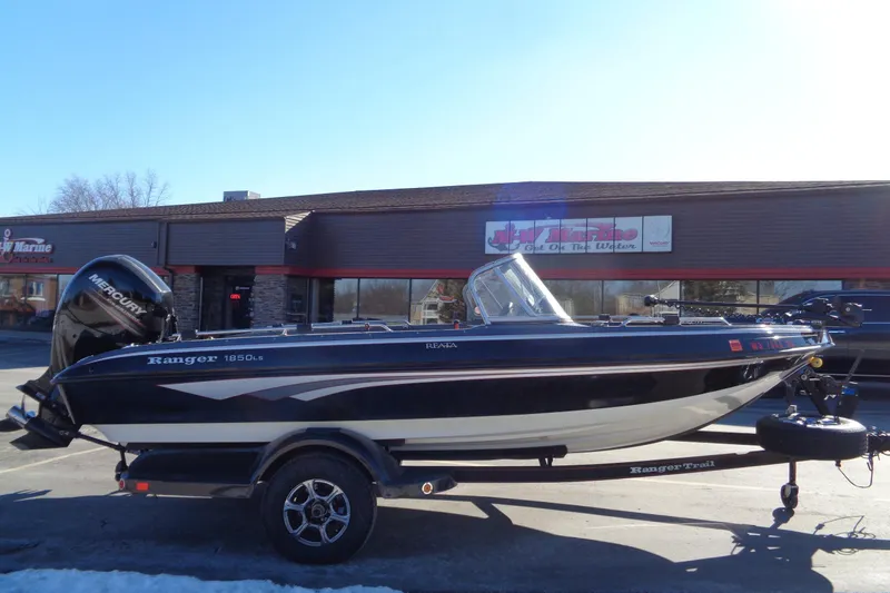 Slide: The Image of 2014 Ranger 1850 LS boat on trailer outside a marine store. - 4