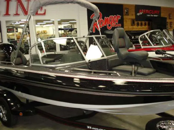 Slide: The Image of 2014 Ranger 1850 LS boat in a showroom. - 7