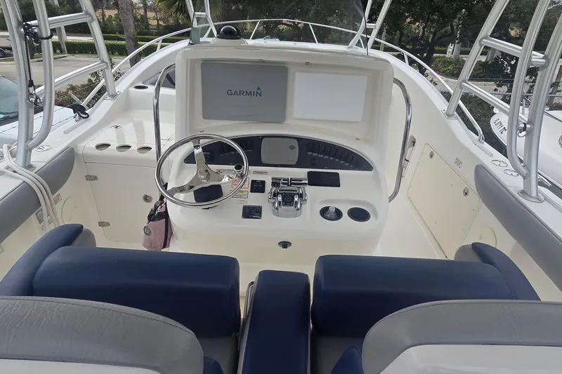 Slide: The Image of 2006 Boston Whaler 320 Outrage Cuddy Cabin helm with Garmin navigation system. - 13