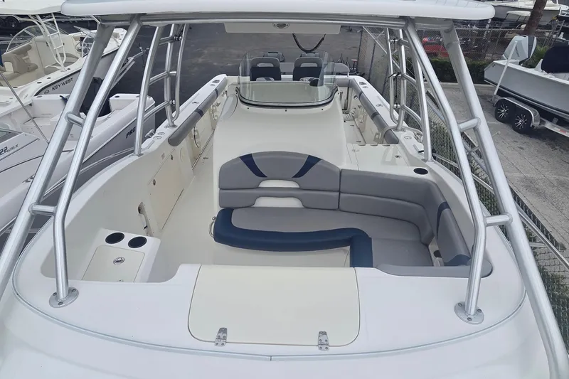 Slide: The Image of 2006 Boston Whaler 320 Outrage Cuddy Cabin with spacious seating and sleek design. - 16