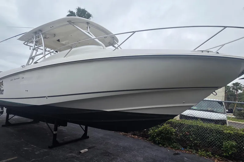 Slide: The Image of 2006 Boston Whaler 320 Outrage Cuddy Cabin boat on display, side view. - 3
