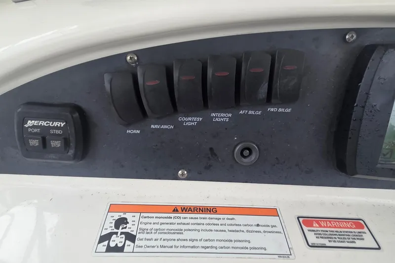 Slide: The Image of Control panel of a 2006 Boston Whaler 320 Outrage Cuddy Cabin boat. - 8