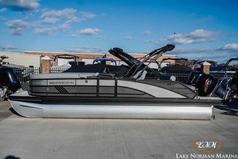 The Image of 2026 Bennington 24MSB pontoon boat at Lake Norman Marina, side view. - 1