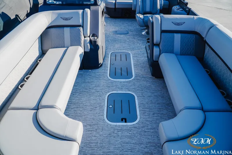 Slide: The Image of 2026 Bennington 24MSB pontoon boat interior with luxurious seating and modern design. - 14