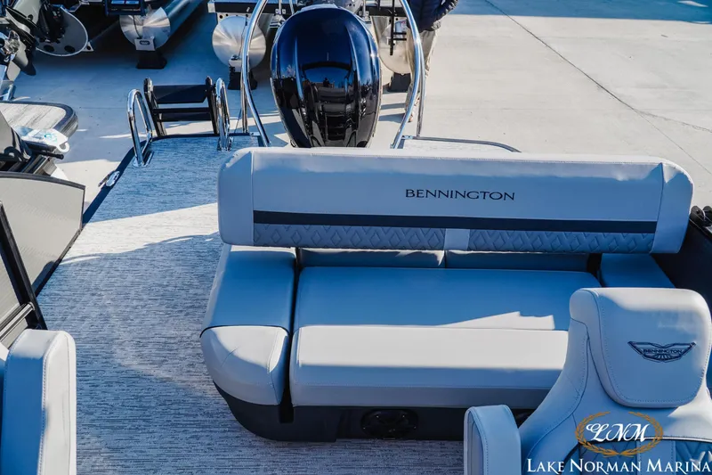 Slide: The Image of 2026 Bennington 24MSB boat interior with plush seating at Lake Norman Marina. - 18