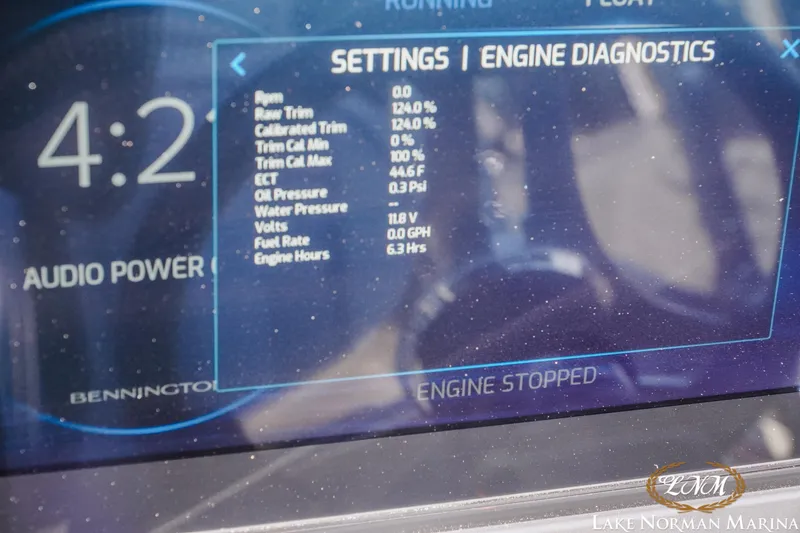 Slide: The Image of Dashboard of a 2026 Bennington 24MSB showing engine diagnostics and settings. - 19