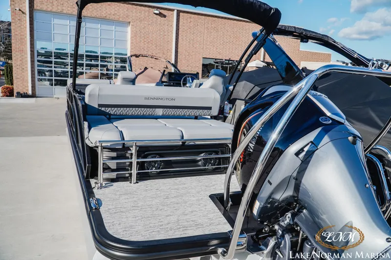 Slide: The Image of 2026 Bennington 24MSB pontoon boat at Lake Norman Marina, showcasing sleek design and modern features. - 4
