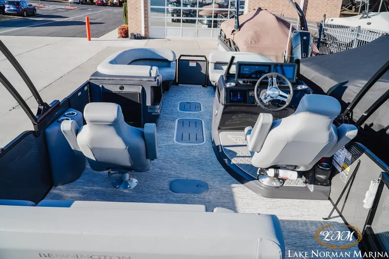 Slide: The Image of 2026 Bennington 24MSB pontoon boat interior with modern helm and seating at Lake Norman Marina. - 6