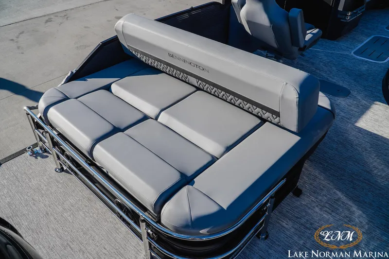 Slide: The Image of 2026 Bennington 24MSB boat with luxurious gray seating at Lake Norman Marina. - 7