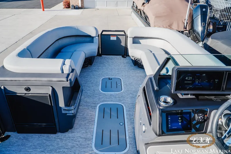 Slide: The Image of Luxurious 2026 Bennington 24MSB pontoon boat interior with plush seating and modern dashboard. - 8