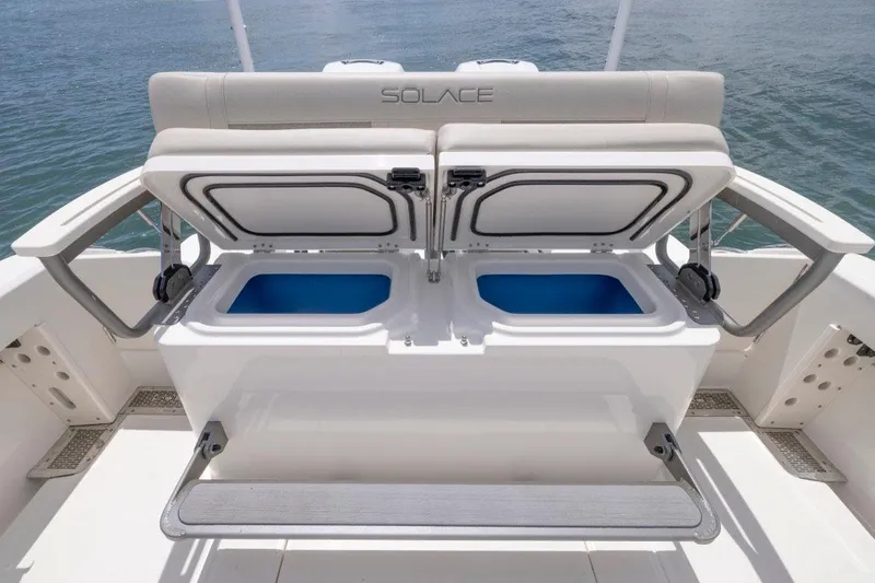Slide: The Image of Manufacturer Provided Image: 2026 Solace 30 HCS boat with open storage compartments, showcasing sleek design and functionality. - 10