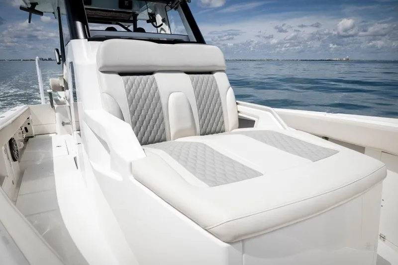 Slide: The Image of Manufacturer Provided Image: 2026 Solace 30 HCS boat interior with luxurious seating on calm ocean. - 5