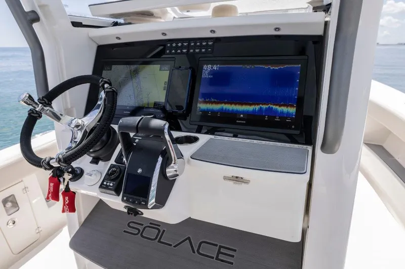 Slide: The Image of Manufacturer Provided Image: 2026 Solace 30 HCS boat dashboard with advanced navigation and control systems. - 7