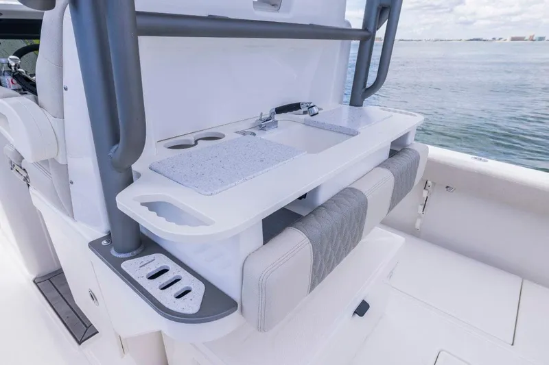 Slide: The Image of Manufacturer Provided Image: Modern 2026 Solace 30 HCS boat interior with sleek kitchenette and ocean view. - 8