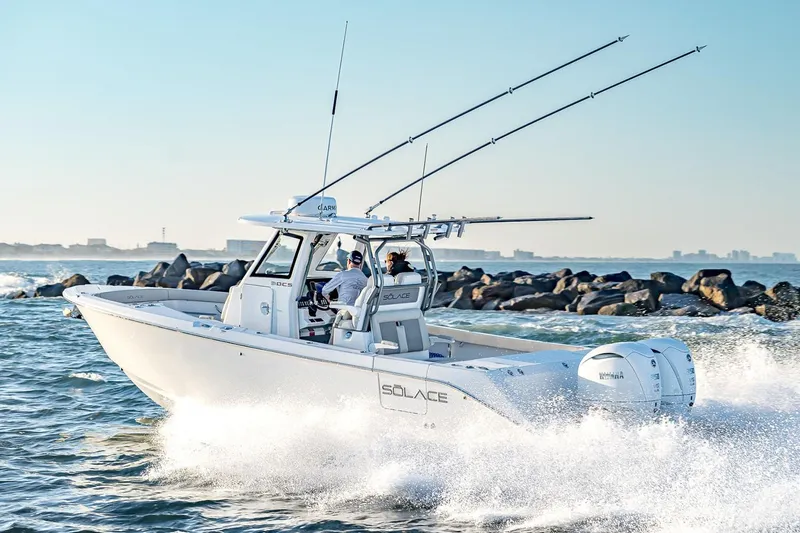 The Image of Manufacturer Provided Image: 2026 Solace 30 CS boat cruising on the ocean near rocky shoreline. - 0