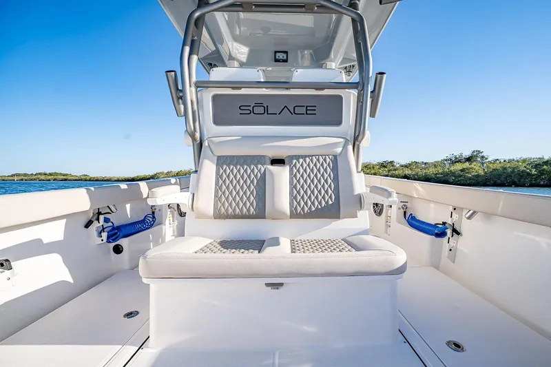 Slide: The Image of Manufacturer Provided Image: 2026 Solace 30 CS boat interior with cushioned seating and sleek design. - 6