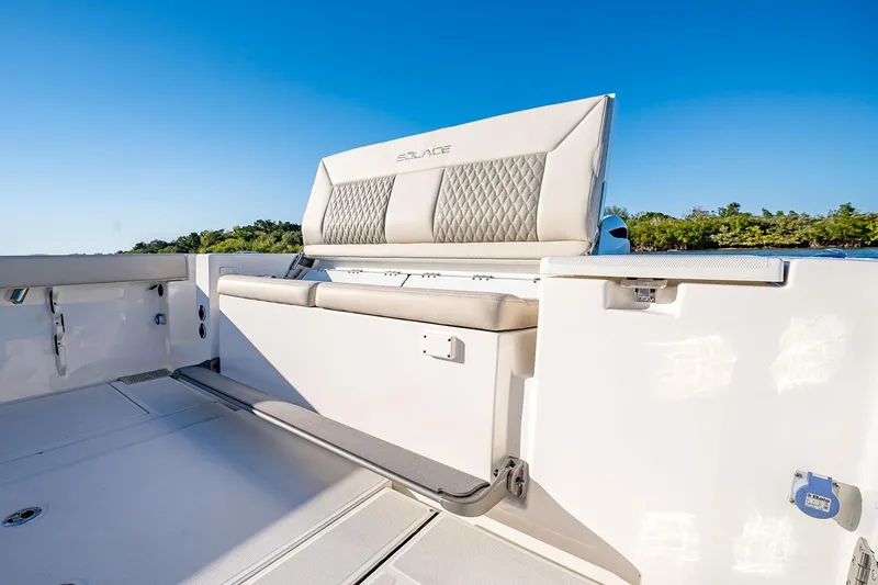 Slide: The Image of Manufacturer Provided Image: 2026 Solace 30 CS boat interior with cushioned seating and sleek design. - 7