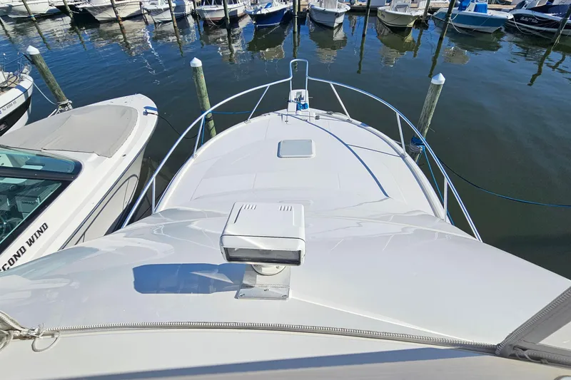 Slide: The Image of 2004 Luhrs 34 Convertible yacht docked at marina, view from bow. - 22