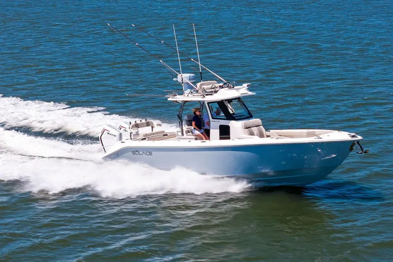 The Image of Manufacturer Provided Image: 2026 Solace 32 CS boat cruising on open water, showcasing sleek design and performance. - 0
