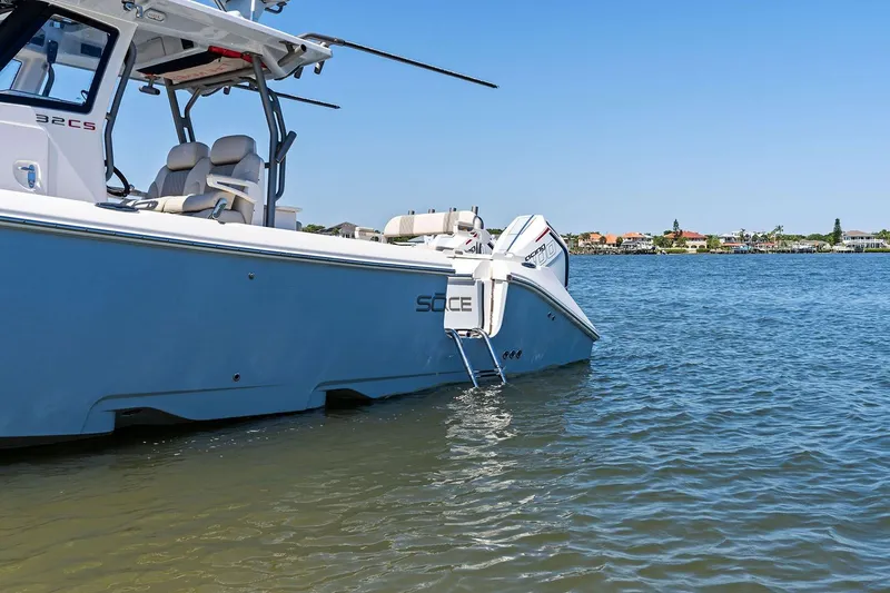 Slide: The Image of Manufacturer Provided Image: 2026 Solace 32 CS boat on calm water with clear blue sky. - 3