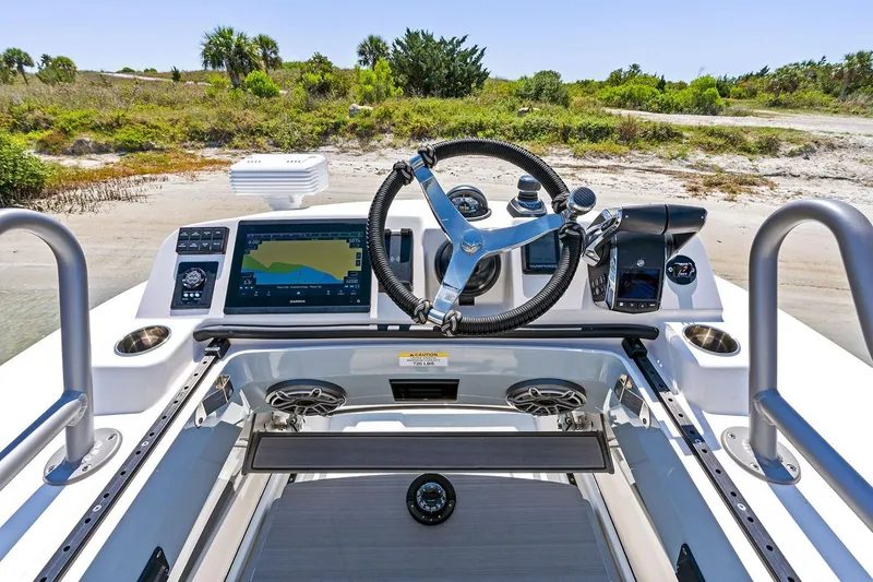 Slide: The Image of Manufacturer Provided Image: Helm of 2026 Solace 32 CS boat with advanced navigation system and steering wheel. - 6