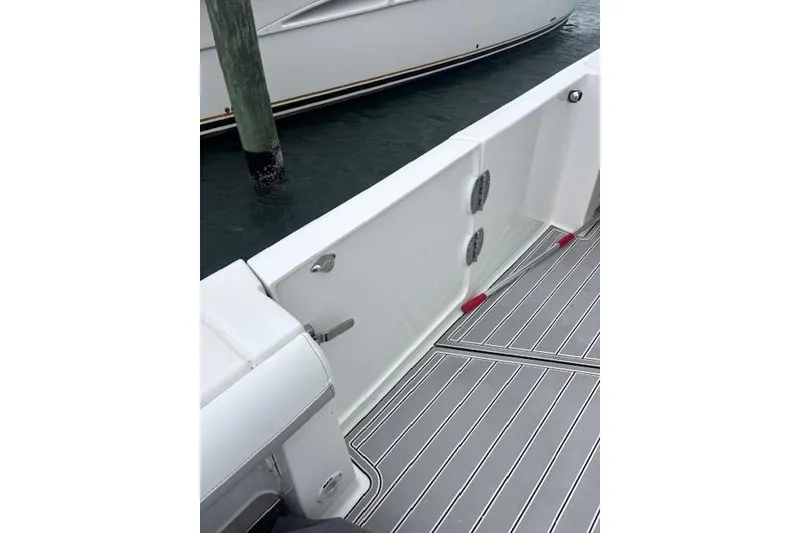 Slide: The Image of 2018 Everglades 435 Center Console boat deck with sleek design and modern fittings. - 16