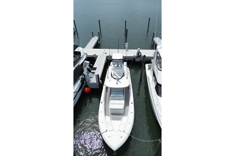Slide: The Image of 2018 Everglades 435 Center Console boat docked at marina, aerial view. - 2